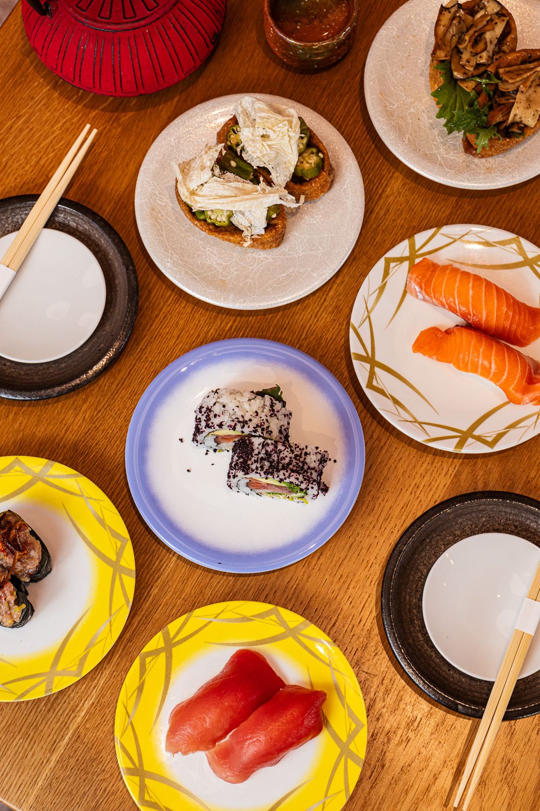 Nigiri and rolls on plates at IKI Sushi